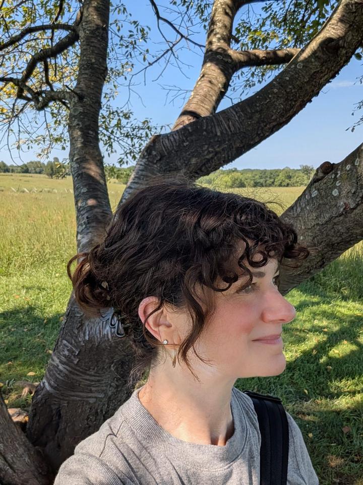 Shelley Rappaport, founder of Measurably Better Advisory, outdoors under a tree